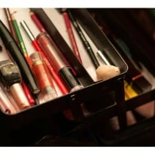 A picture of make-up inside of make up kit box