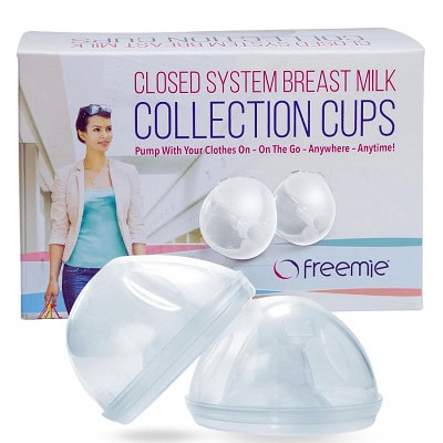Two breastmilk collection cups with the packaging next to them