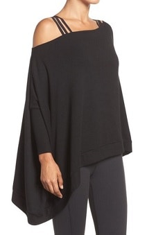 A woman wearing a \'Cozy\' Convertible Fleece Pullover.