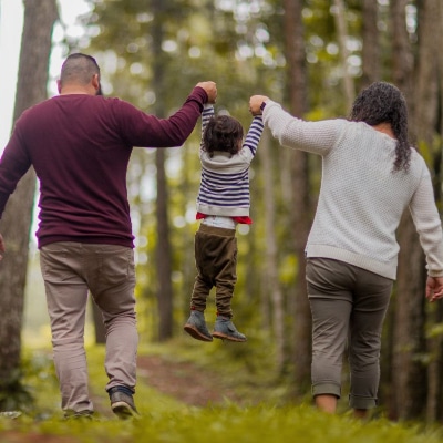 A family walking in the woods