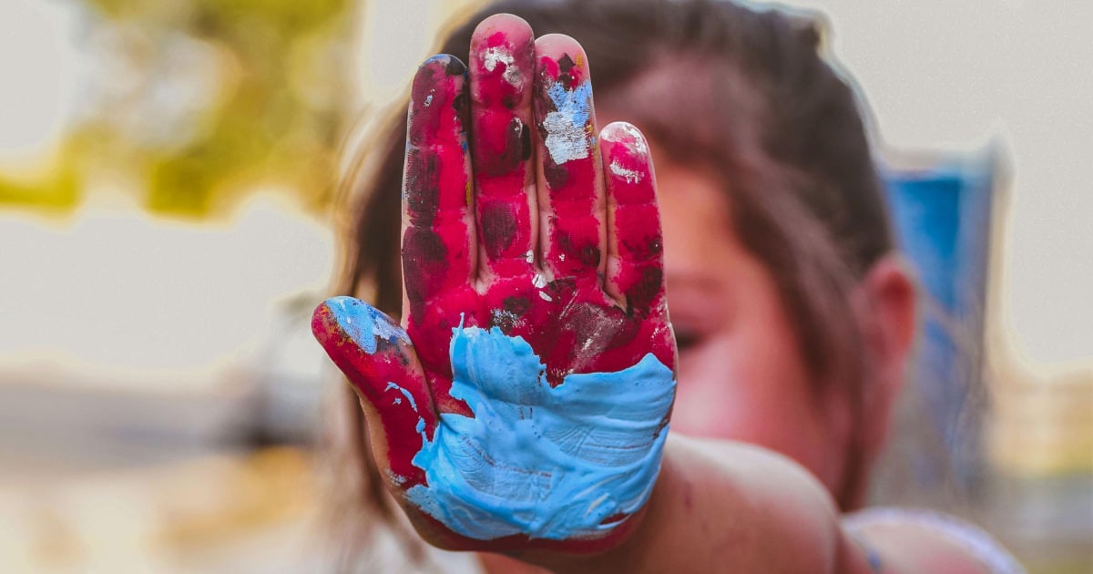 A little girl hand-painting