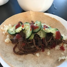 A plate of braised beef tacos
