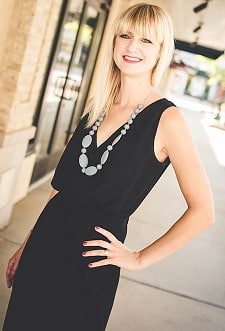 A woman wearing a Organic Silicone Teething Necklace.