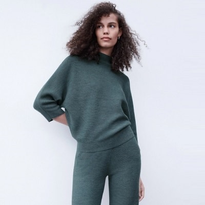 woman wearing green sweater and matching green pants