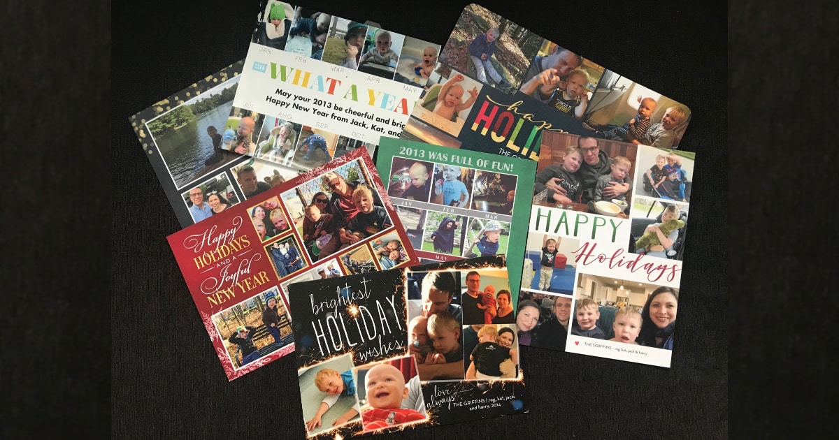 a messy pile of Kat's family holiday cards from Shutterfly over the past 8 years