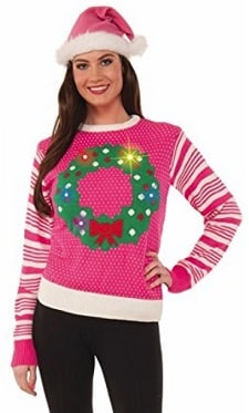 A woman wearing a Light-Up Ugly Christmas Sweater