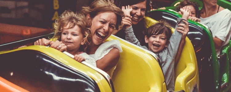 parents and children on a roller coaster ride