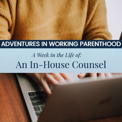 A woman wearing a yellow sweater working at a wooden desk and typing on a laptop. The text overlay reads, "Adventures in Working Parenthood: A Week in the Life of an In-House Counsel"