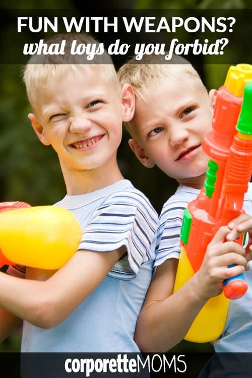 Two boys having fun with water guns