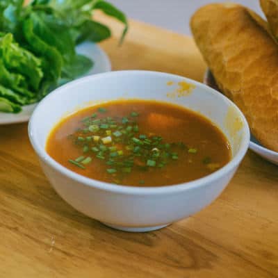 A bowl of soup on a table