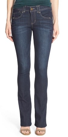 A woman wearing a pair of Ab-solution Itty Bitty Bootcut Jeans
