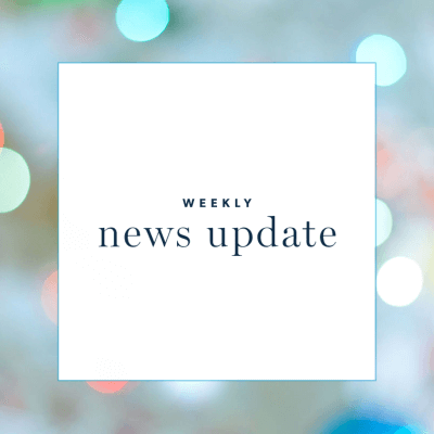 a white square with text "weekly news update," surrounded by a border of dots of light