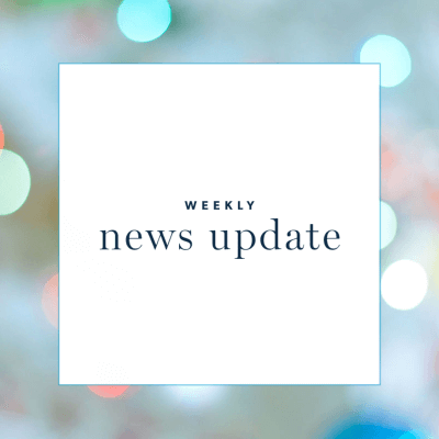 a white square with text "weekly news update," surrounded by a border of dots of light
