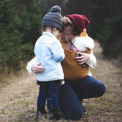 A mother and her children\'s outside.