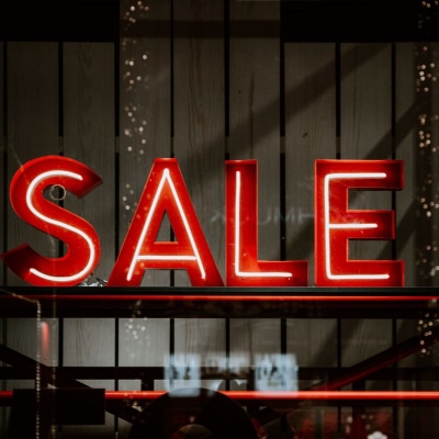 neon lights spell out the word SALE